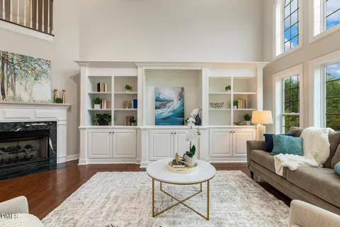 a kitchen with stainless steel appliances kitchen island granite countertop a stove microwave and cabinets