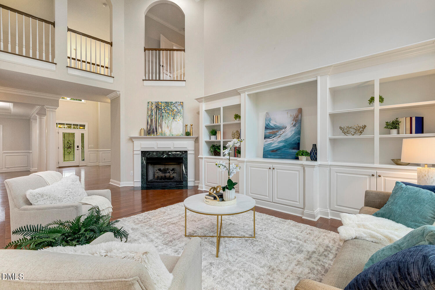 404 Vintage Hill Circle Apex, NC 27539 - Photo 20 of 82 a living room with furniture a fireplace and a potted plant