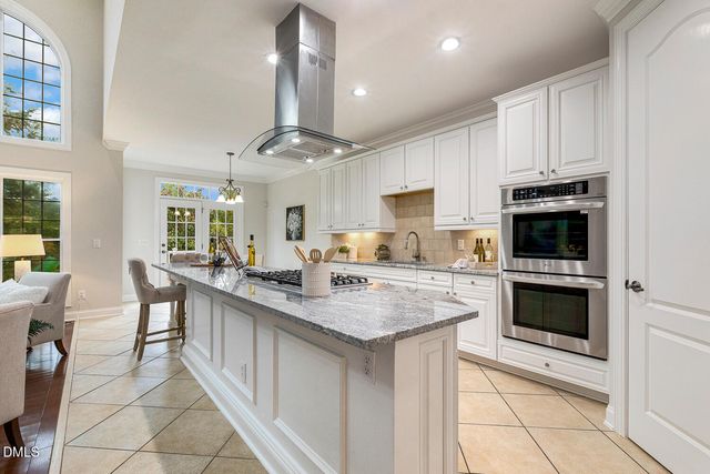 a view of an entryway with wooden floor and a window