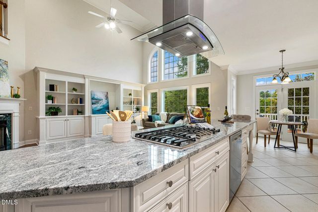 an empty room with window and a ceiling fan