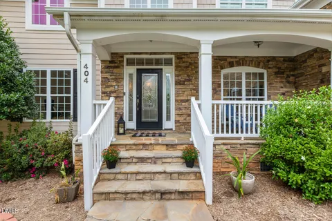 a view of a balcony with chair and door