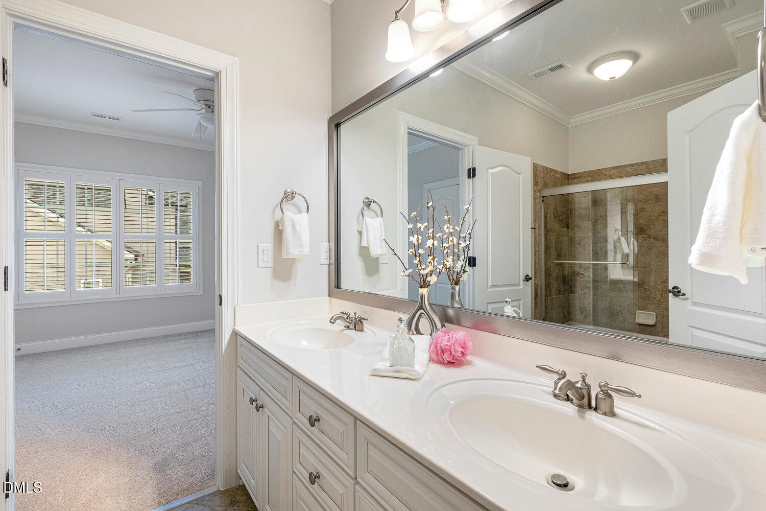 404 Vintage Hill Circle Apex, NC 27539 - Photo 59 of 82 a bathroom with a double vanity sink mirror and next to a window