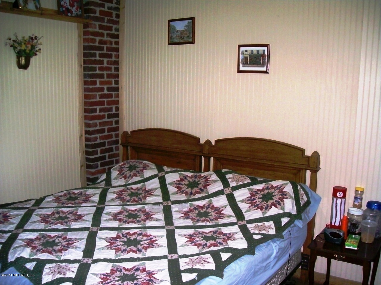 7715 Ranchette Road Keystone Heights, FL 32656 - Photo 23 of 32 a bedroom with a bed and a dresser