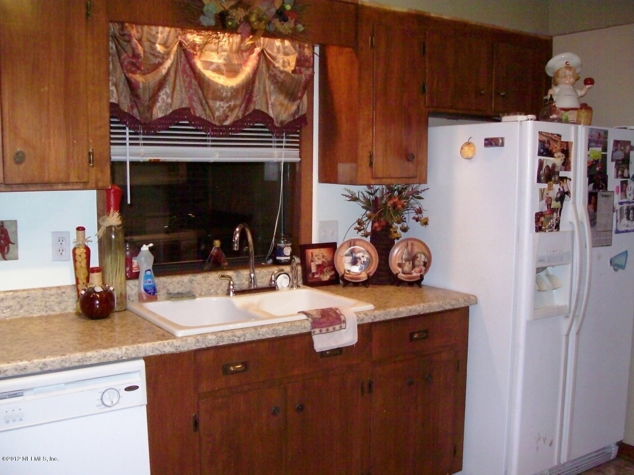 7715 Ranchette Road Keystone Heights, FL 32656 - Photo 30 of 32 a kitchen with stainless steel appliances a stove and a refrigerator