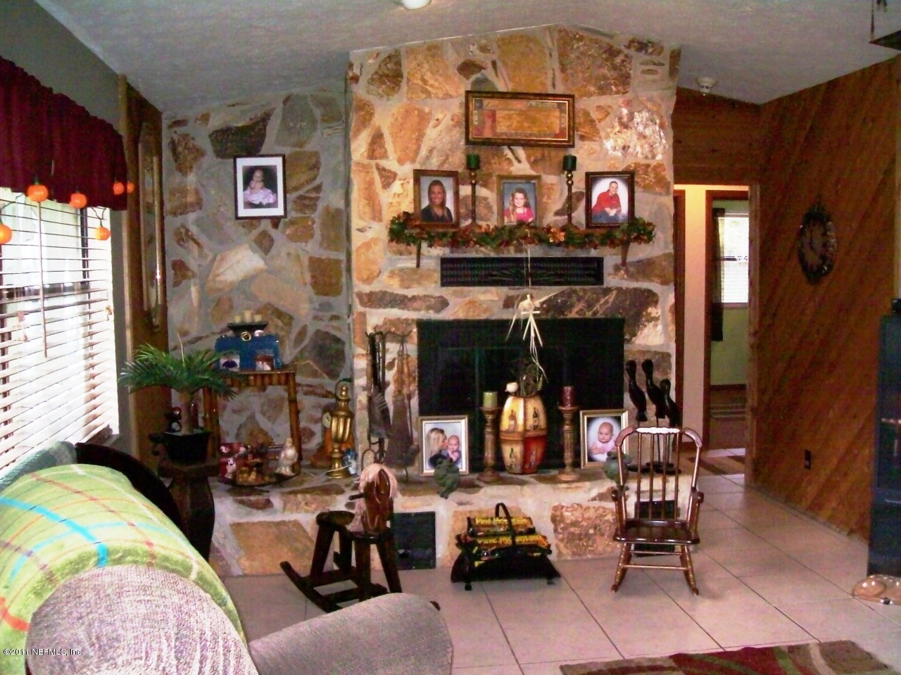 7715 Ranchette Road Keystone Heights, FL 32656 - Photo 9 of 32 a living room with lots of furniture and a fireplace