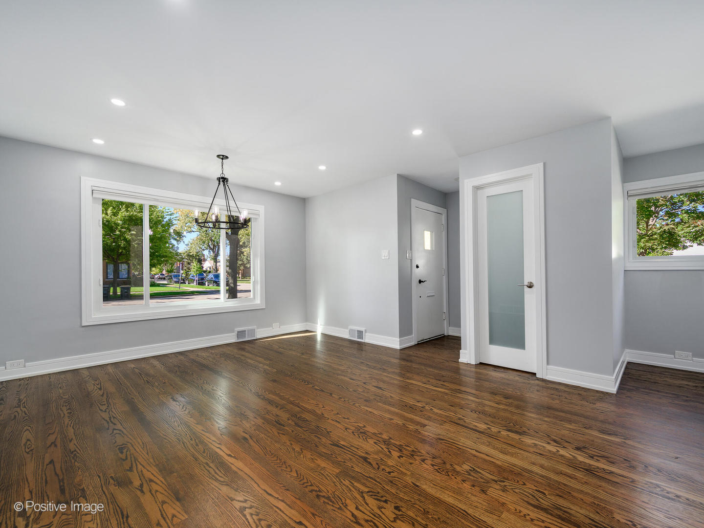 7225 East Prairie Road Lincolnwood, IL 60712 - Photo 12 of 27 an empty room with wooden floor and window