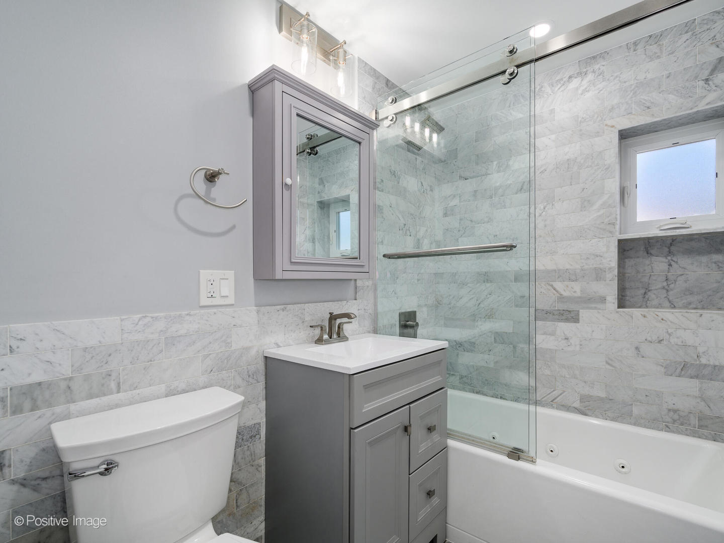 7225 East Prairie Road Lincolnwood, IL 60712 - Photo 19 of 27 a bathroom with a sink mirror toilet and bathtub