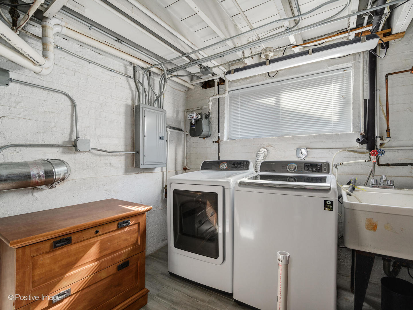 7225 East Prairie Road Lincolnwood, IL 60712 - Photo 21 of 27 a kitchen with stainless steel appliances granite countertop a stove and a sink