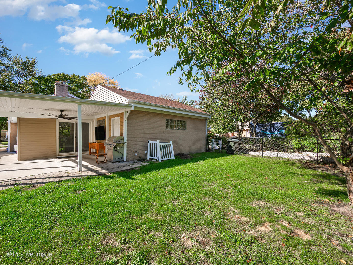 7225 East Prairie Road Lincolnwood, IL 60712 - Photo 26 of 27 a view of a house with a yard and sitting area