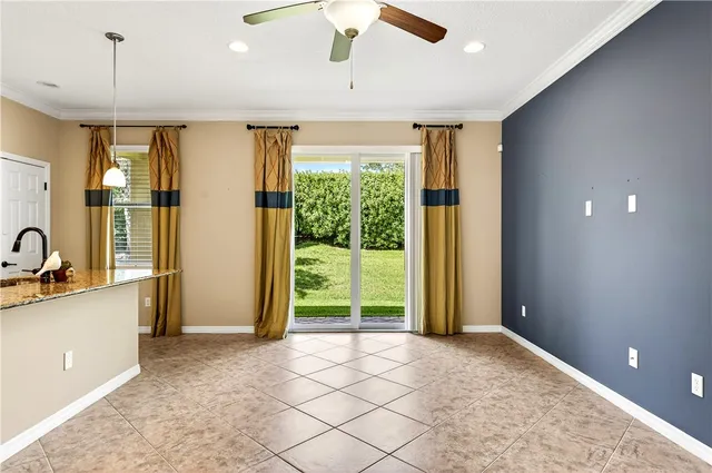 a view of a kitchen with a sink and a window