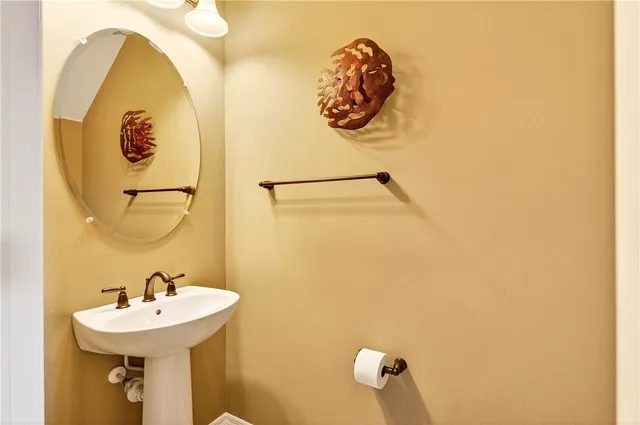 a bathroom with a sink and mirror