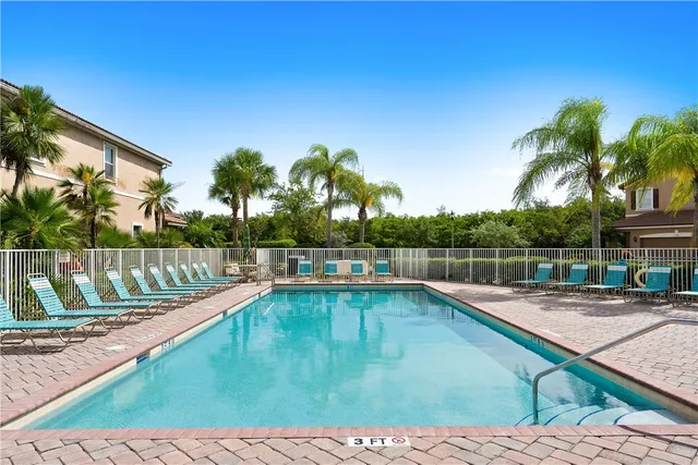 a view of a swimming pool with a lounge chair