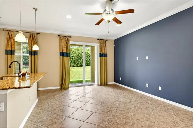 a view of a kitchen with a sink and a chandelier