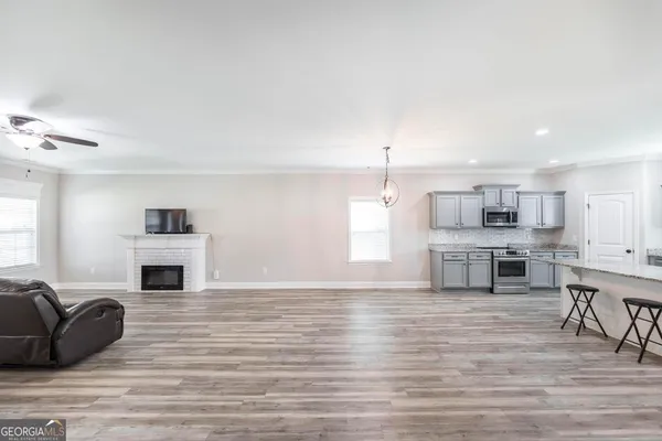a living room with furniture and a fireplace