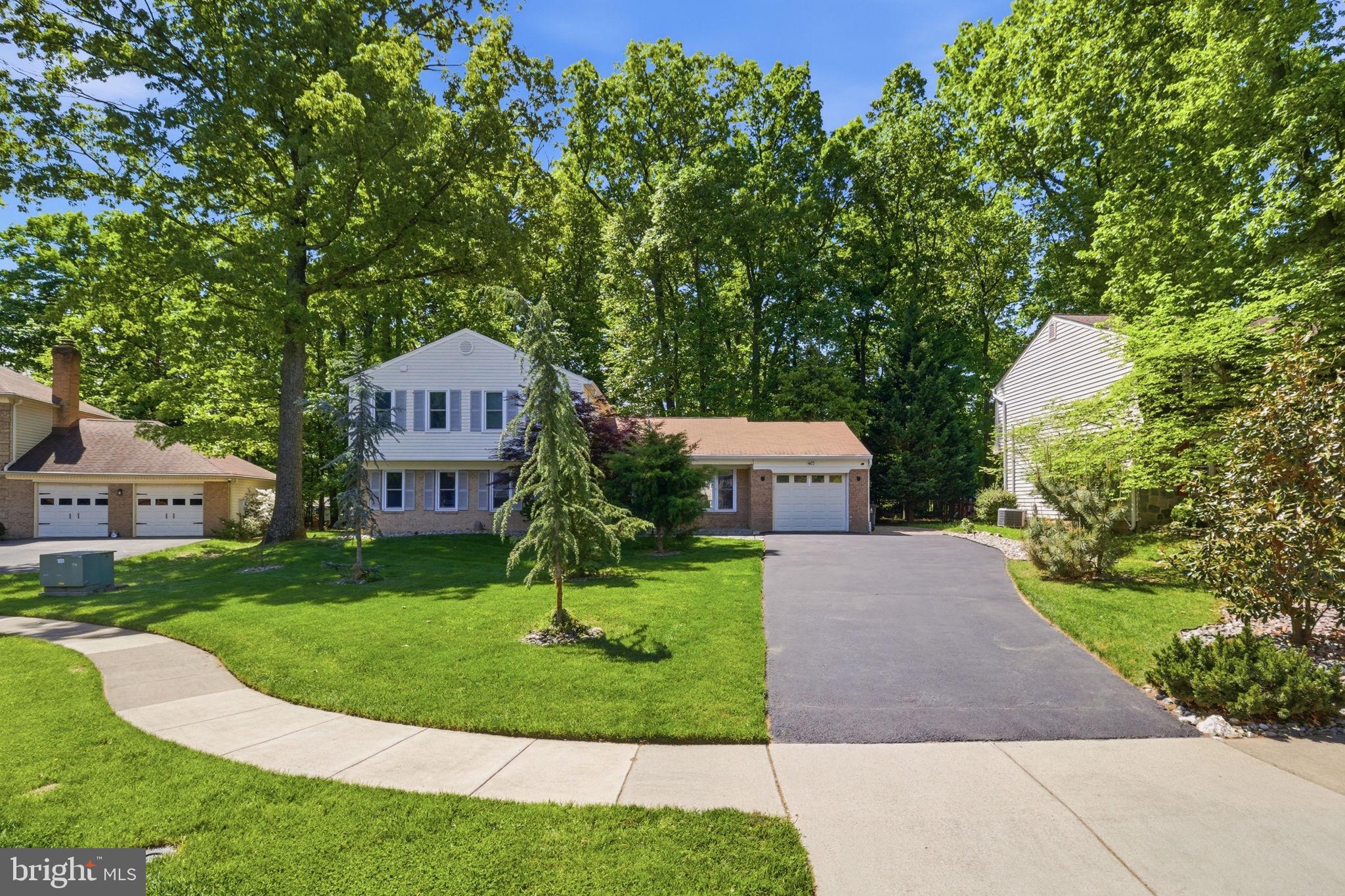 407 Autumn Olive Way Sterling, VA 20164 - Photo 1 of 47 a front view of a house with a yard and trees