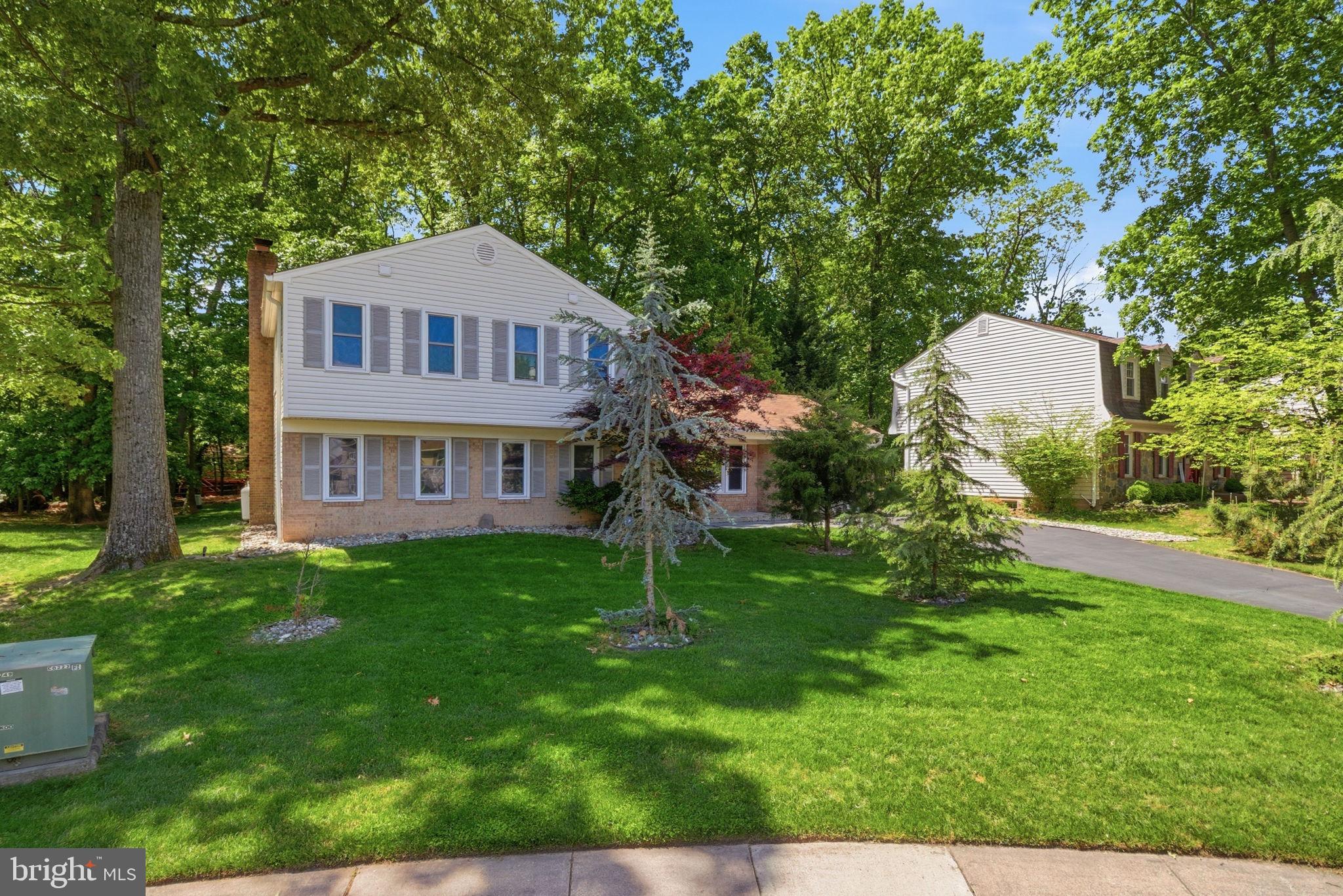 407 Autumn Olive Way Sterling, VA 20164 - Photo 2 of 47 a front view of a house with a yard