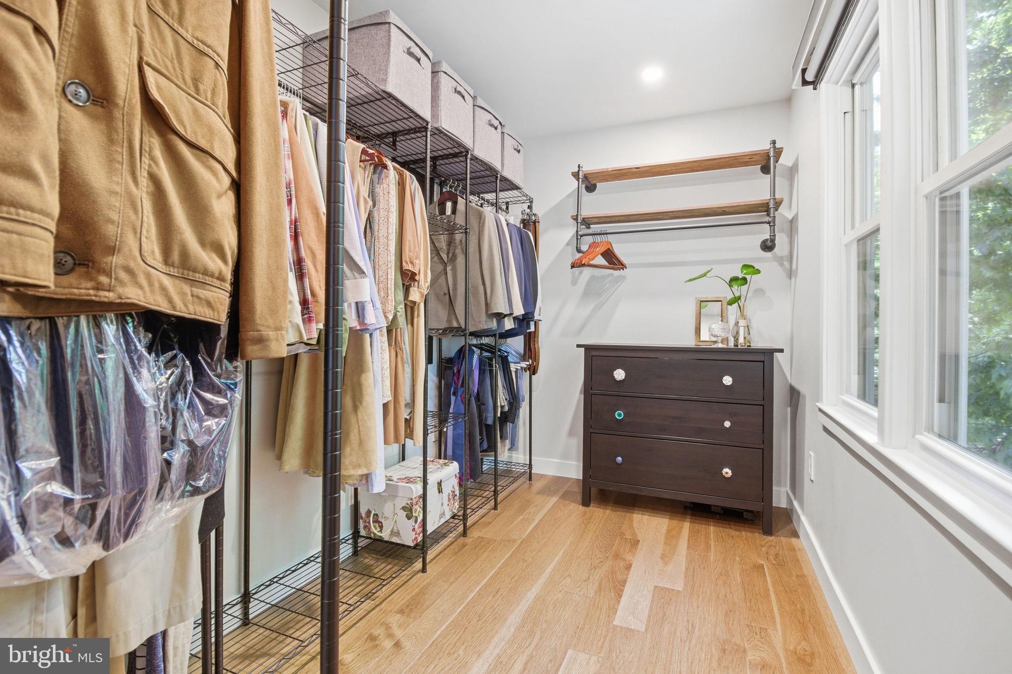407 Autumn Olive Way Sterling, VA 20164 - Photo 23 of 47 a view of walk in closet with clothes and shoes