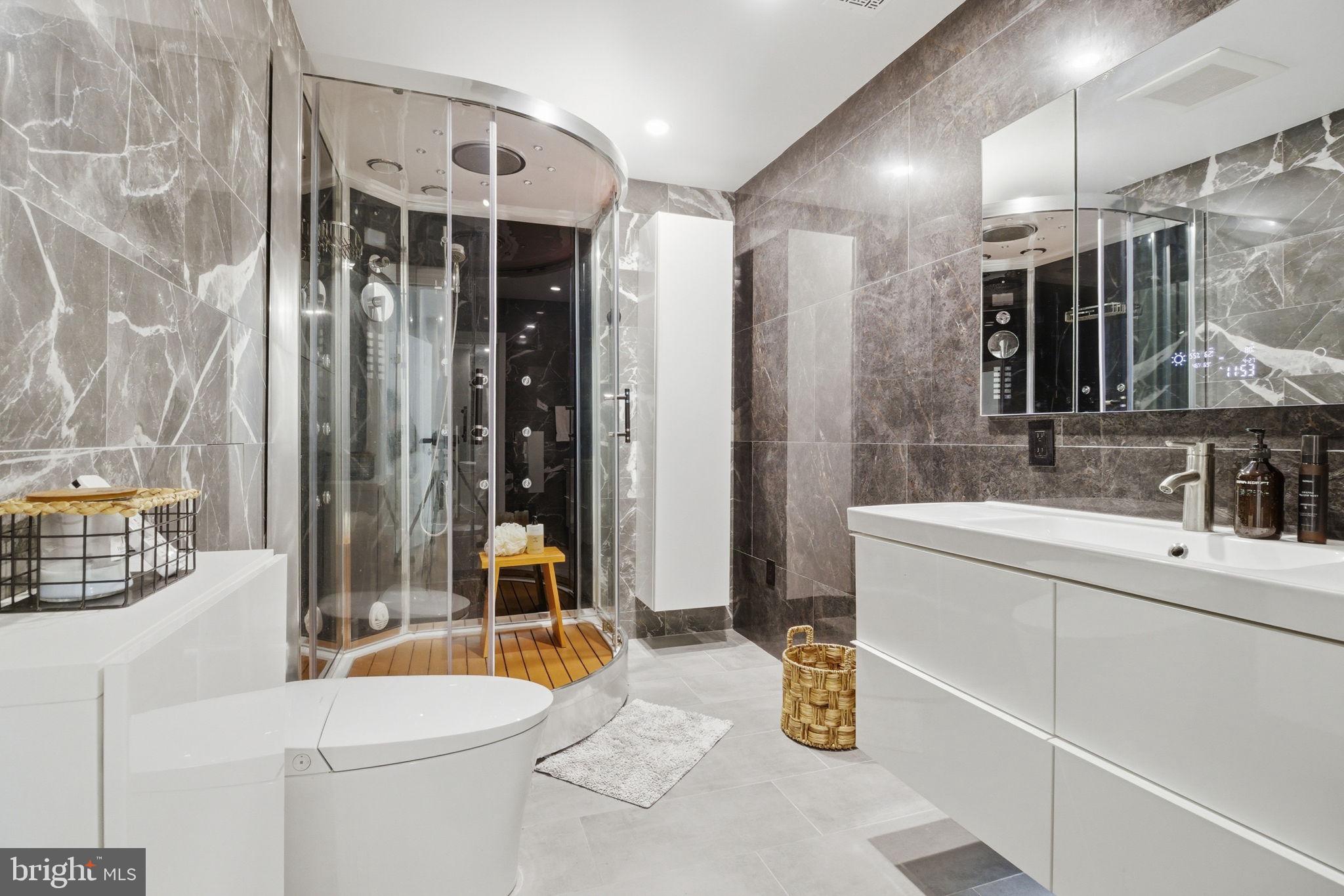 407 Autumn Olive Way Sterling, VA 20164 - Photo 24 of 47 a bathroom with a sink mirror vanity and toilet