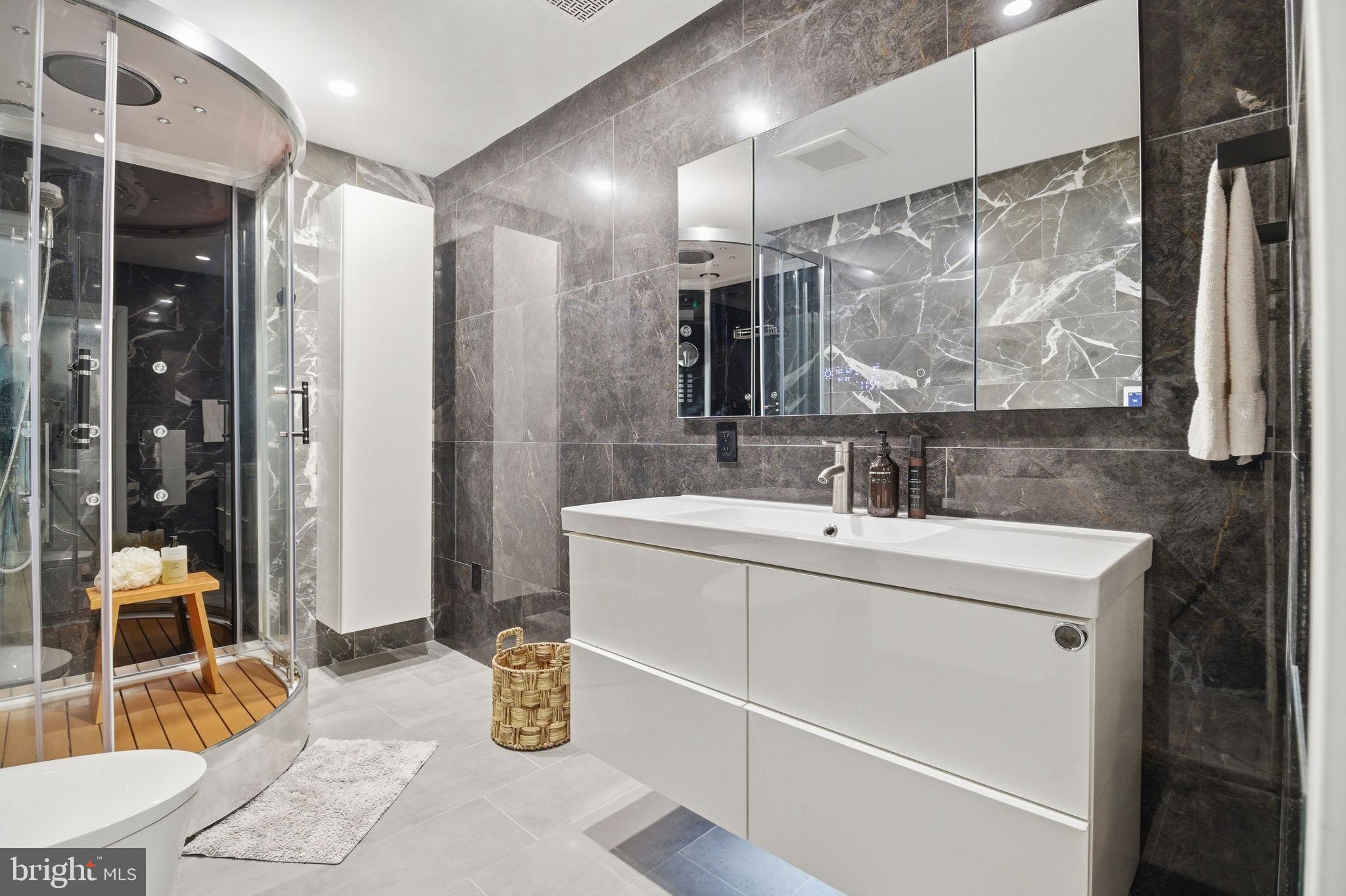 407 Autumn Olive Way Sterling, VA 20164 - Photo 25 of 47 a bathroom with a sink and a mirror