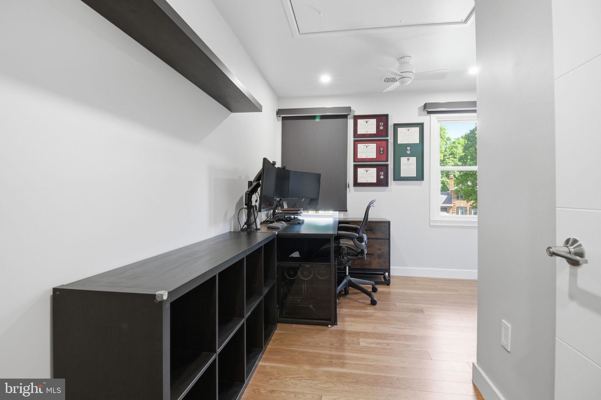 407 Autumn Olive Way Sterling, VA 20164 - Photo 26 of 47 a view of a workspace with furniture and wooden floor