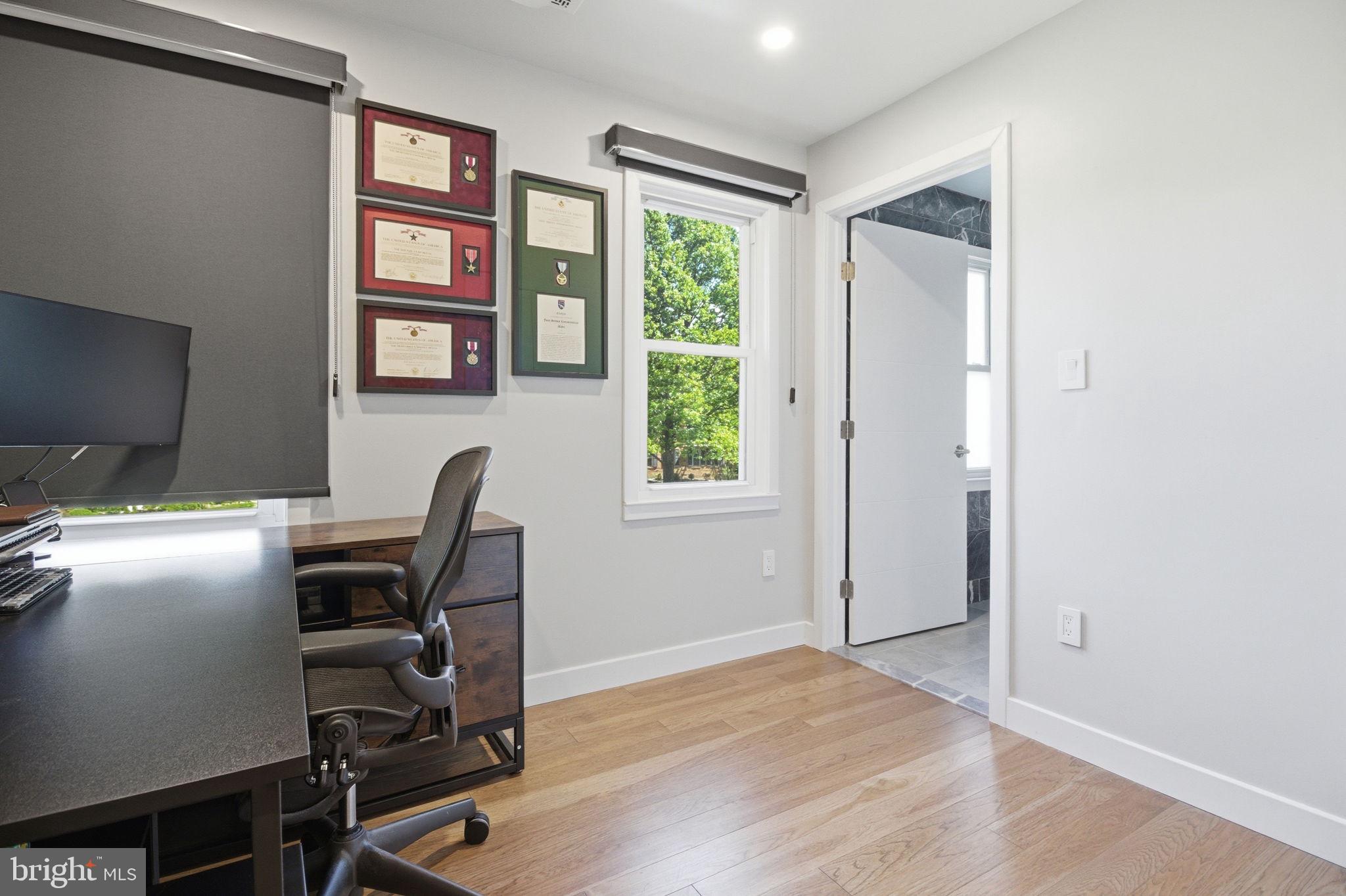 407 Autumn Olive Way Sterling, VA 20164 - Photo 27 of 47 a view of a workspace with furniture and a window
