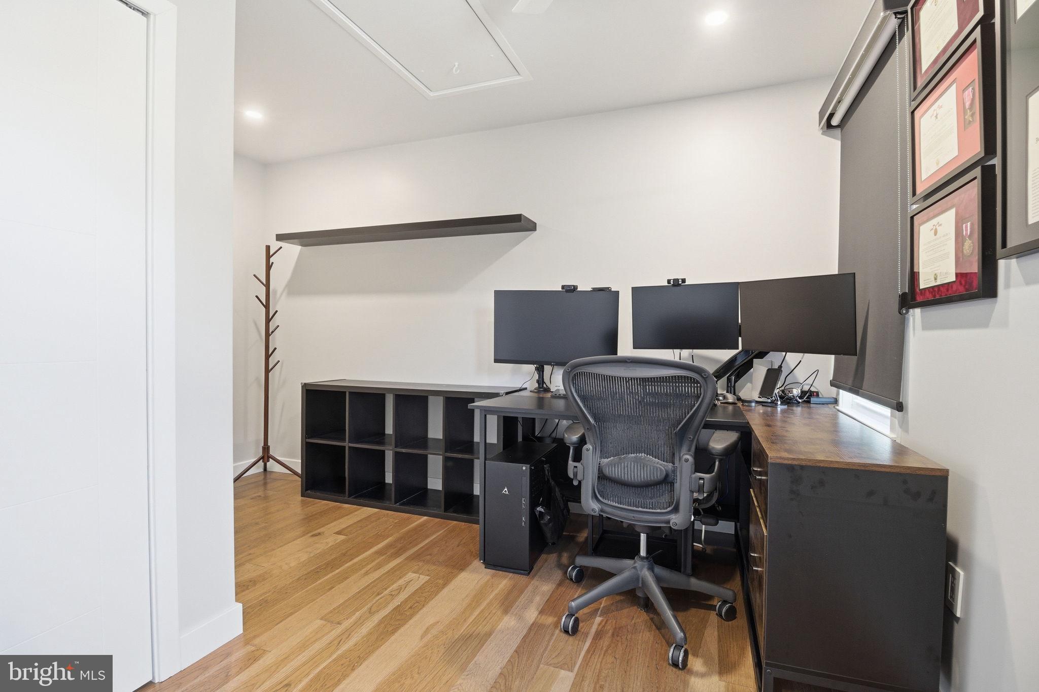 407 Autumn Olive Way Sterling, VA 20164 - Photo 28 of 47 a view of a workspace with furniture and wooden floor