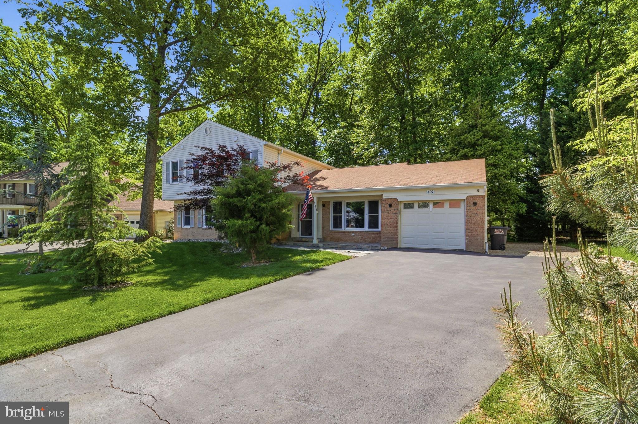 407 Autumn Olive Way Sterling, VA 20164 - Photo 3 of 47 a house with green field in front of it