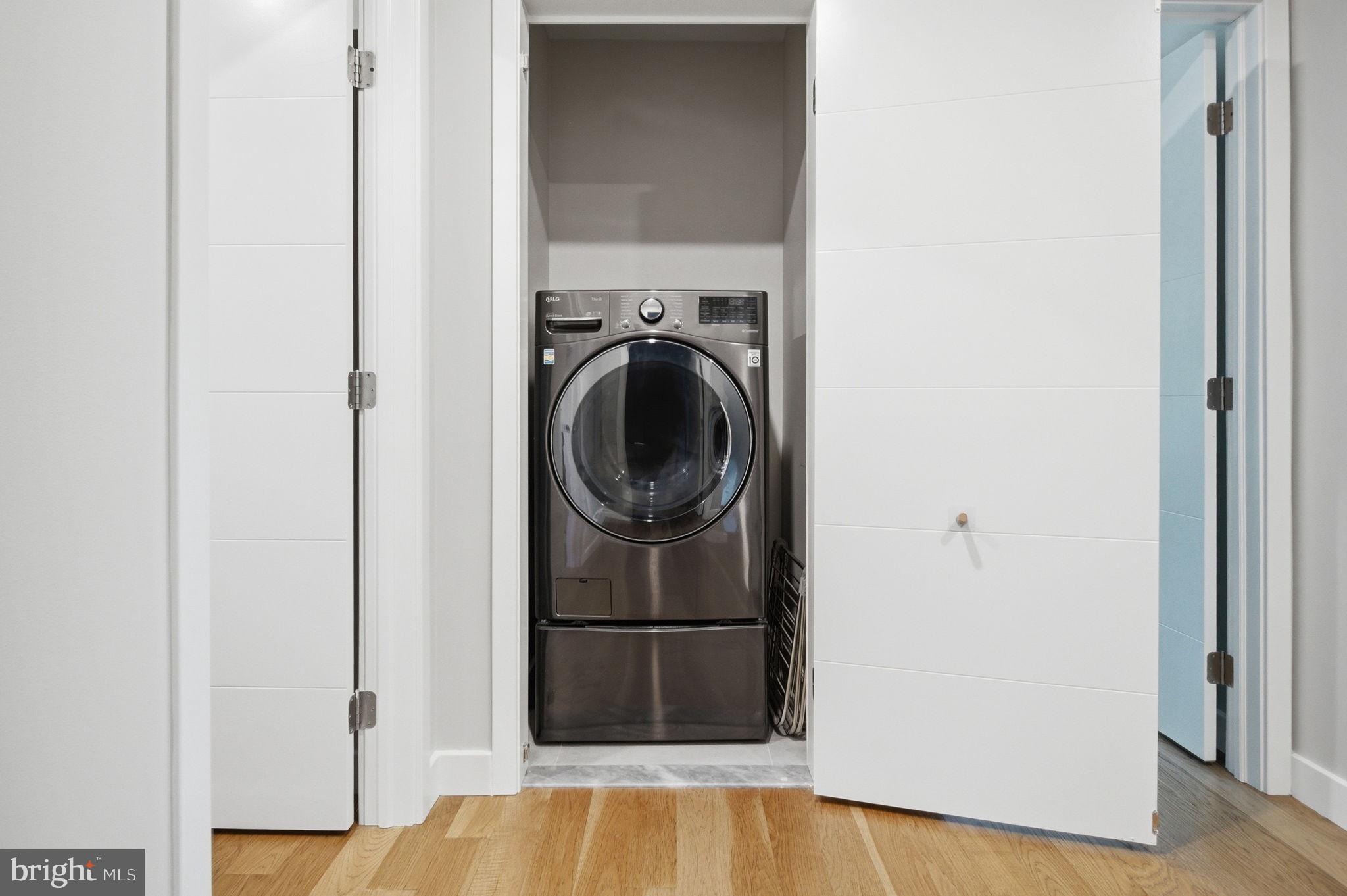 407 Autumn Olive Way Sterling, VA 20164 - Photo 36 of 47 a view of a hallway with washer and dryer