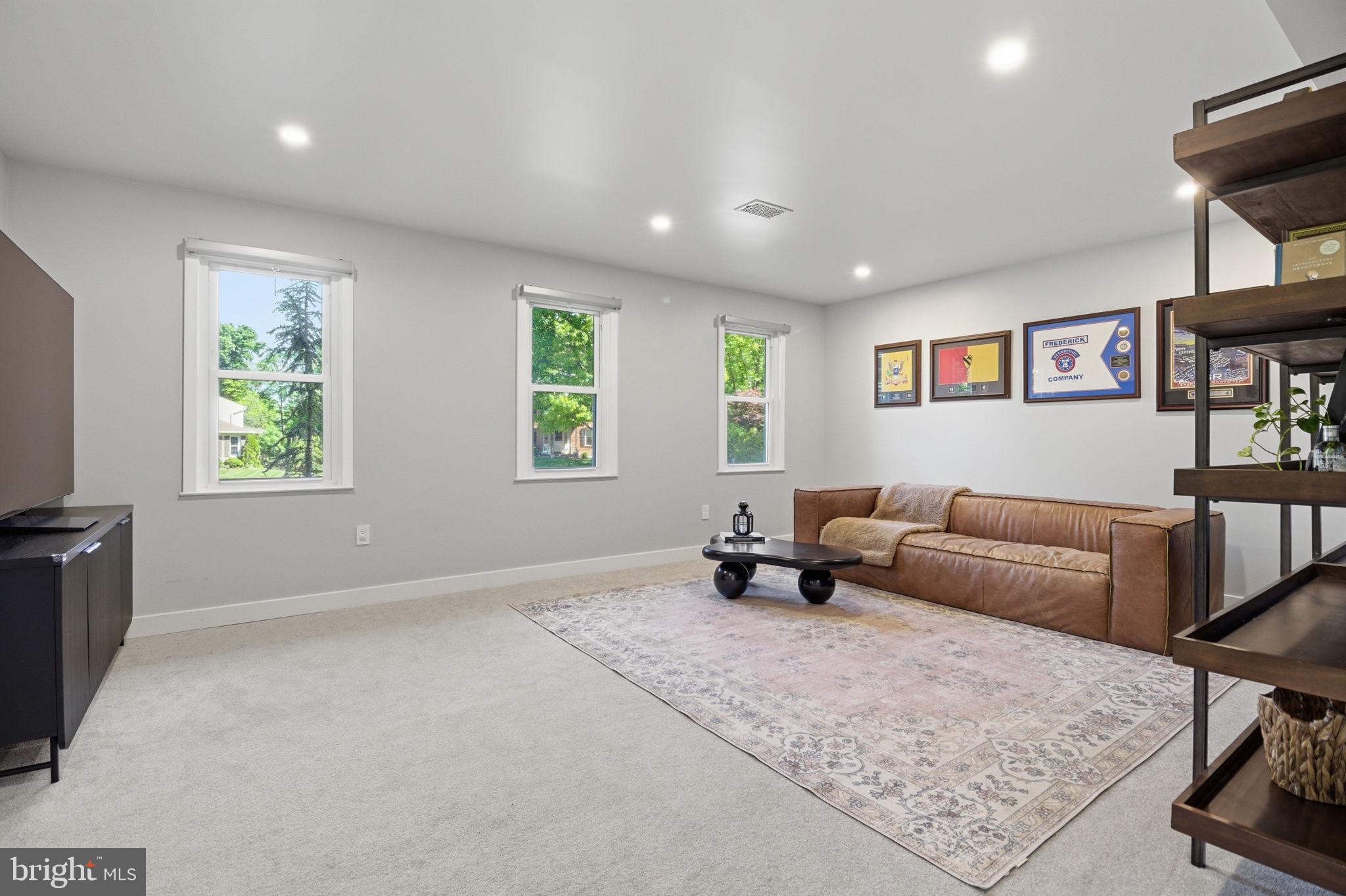 407 Autumn Olive Way Sterling, VA 20164 - Photo 9 of 47 a living room with furniture and a window