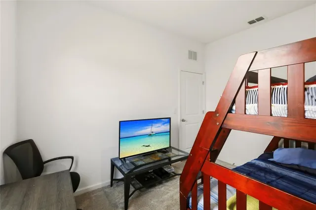 a bedroom with furniture and a stairs