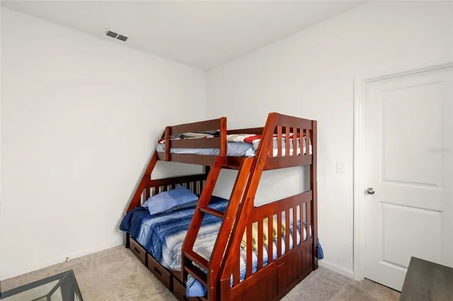 a bedroom with bunk bed