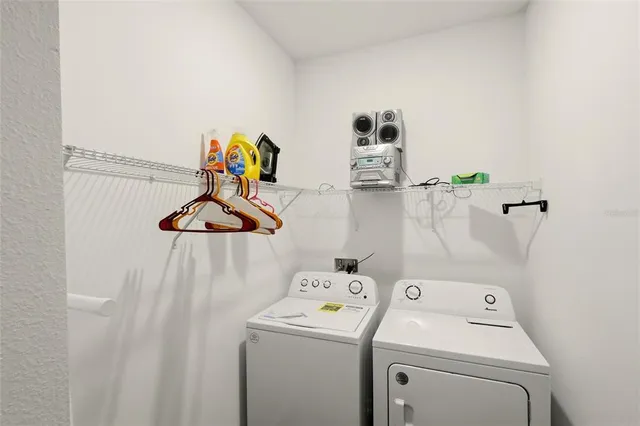 a utility room with dryer and washer