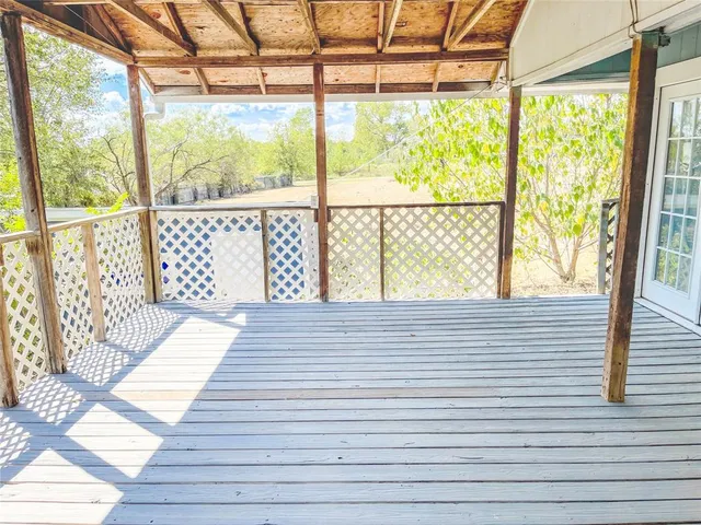 a view of a field with trees