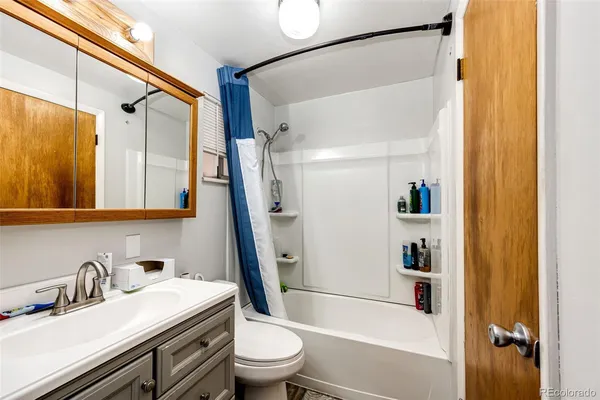 a room with storage and a shelf