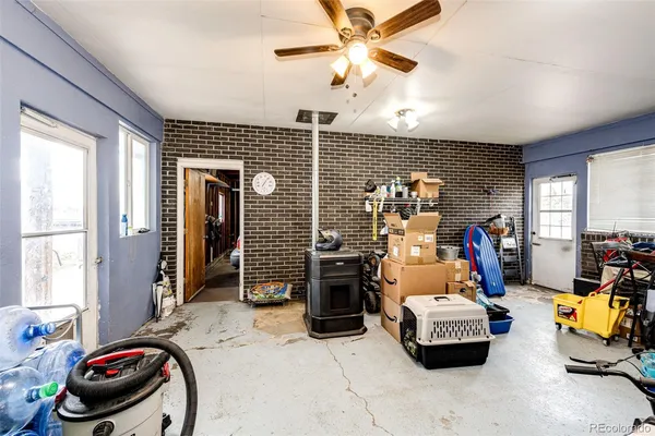 a kids bedroom with a bed next to a window