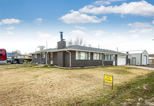 a kitchen with stainless steel appliances granite countertop a stove a sink dishwasher and a microwave oven with cabinets