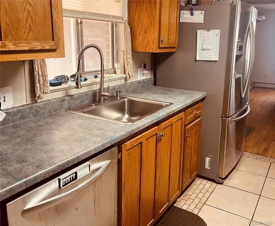 a close view of a sink a counter and a stove in a kitchen