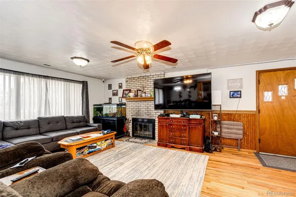 a bedroom with furniture and a flat screen tv