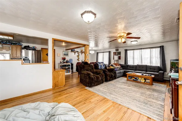 a living room with furniture fireplace and flat screen tv