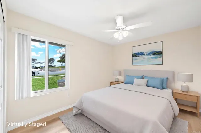 a bedroom with a large bed and a window