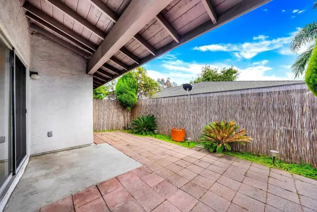 a view of a backyard with a swing
