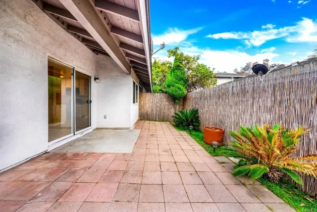 a view of a pathway with a flower in a garden