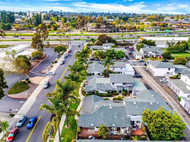 an aerial view of residential houses with outdoor space