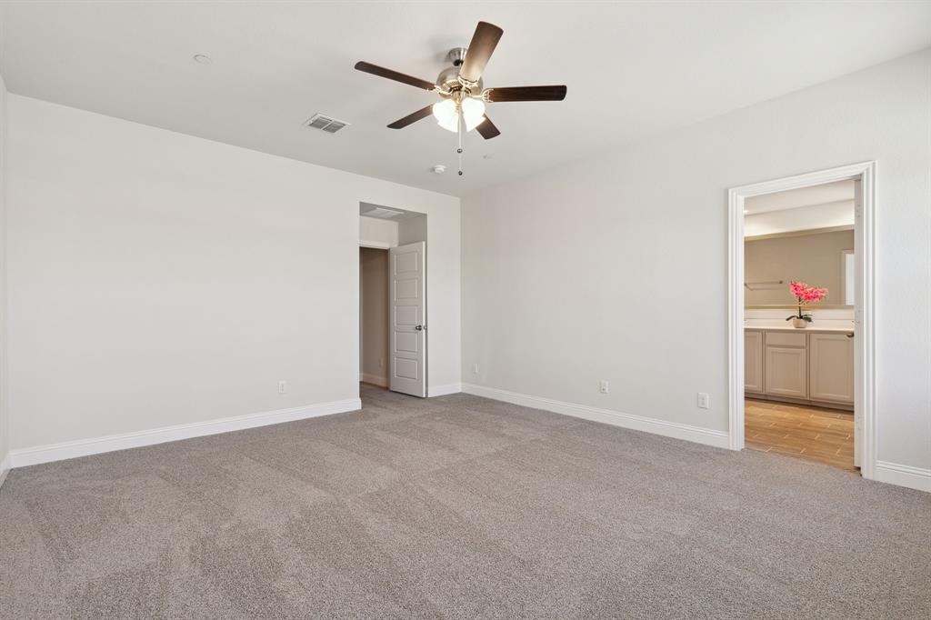 6028 Bursey Road Watauga, TX 76148 - Photo 19 of 27 an empty room with closet and a ceiling fan