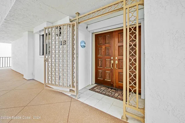 a view of a door and a window