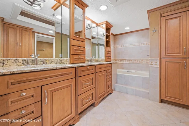 a view of a bathroom with a tub and shower