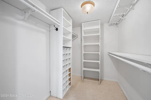 a bathroom with a toilet a sink and shower