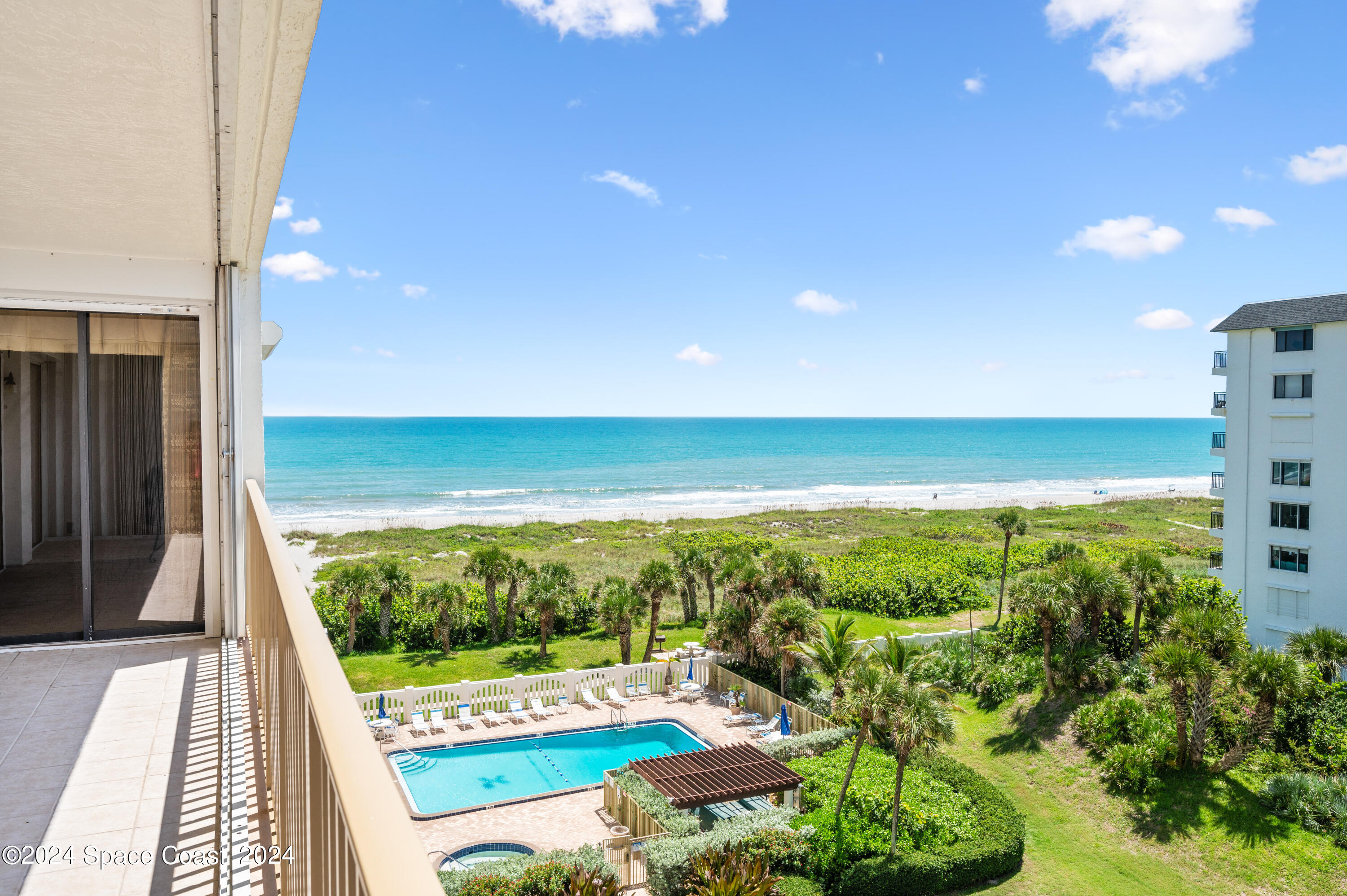 750 North Atlantic Avenue, Unit 608 Cocoa Beach, FL 32931 - Photo 2 of 39 a view of a city from a balcony