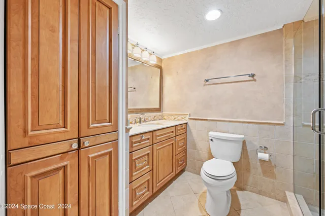 a bathroom with a shower and a toilet