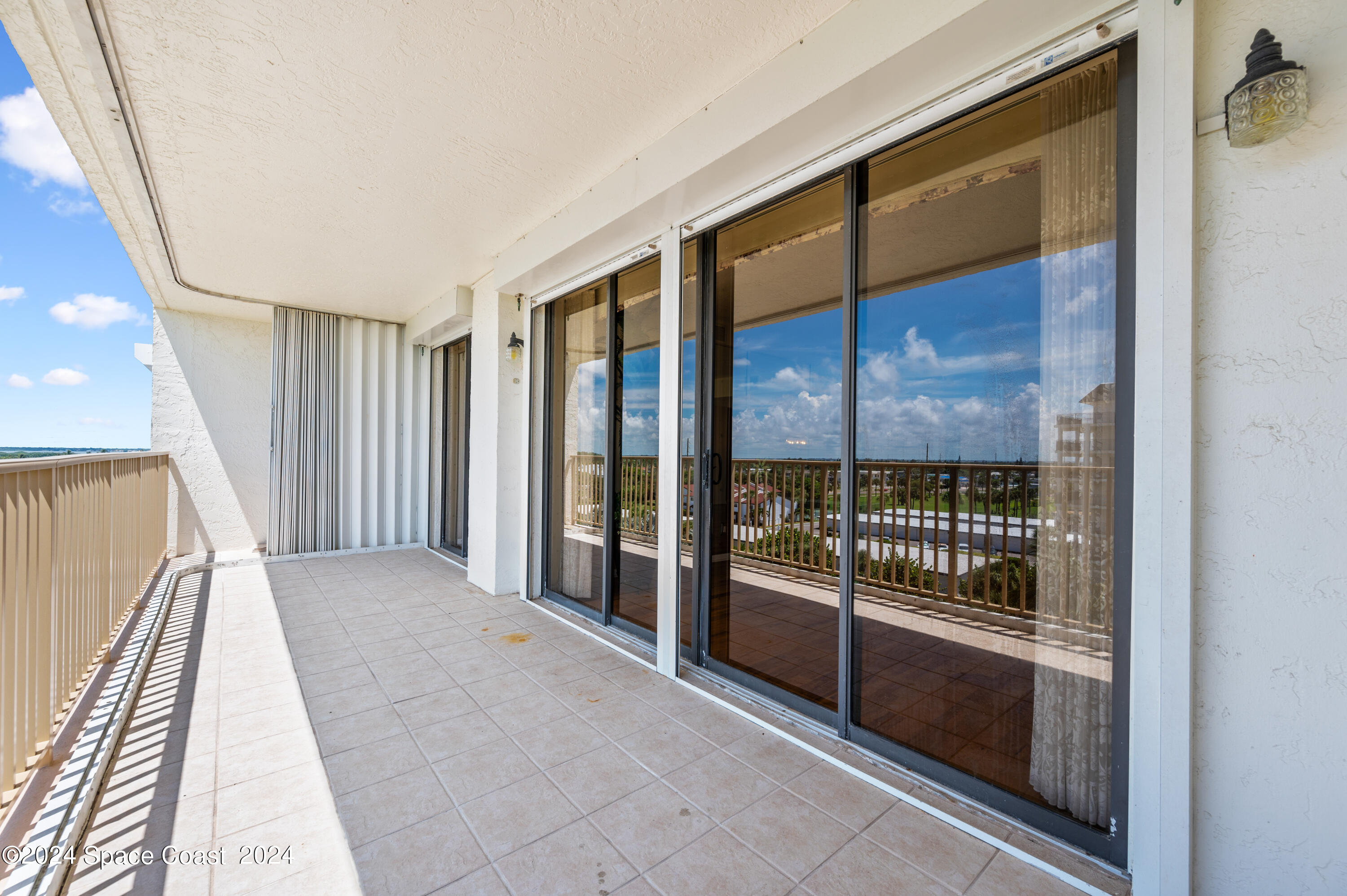 750 North Atlantic Avenue, Unit 608 Cocoa Beach, FL 32931 - Photo 30 of 39 a view of a hallway with a large window